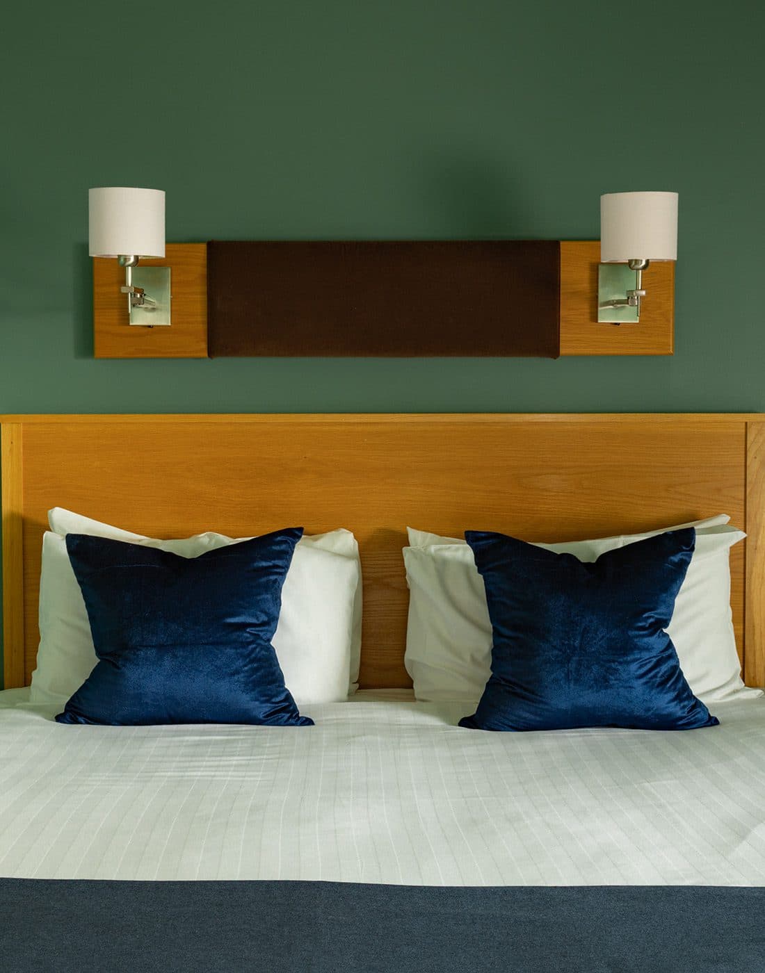 tight shot of bed with throw pillows