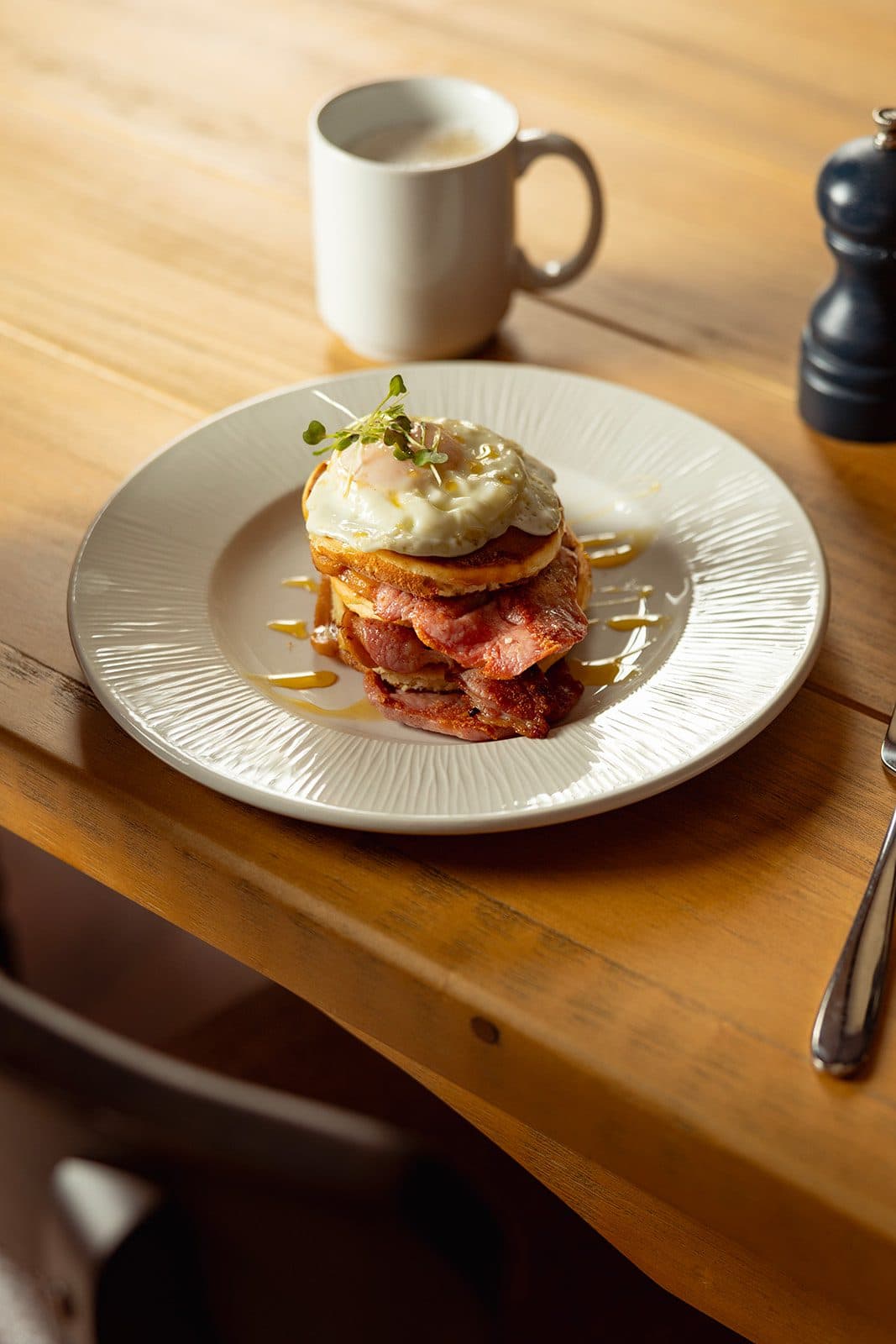 Pancakes with bacon and a fried egg.
